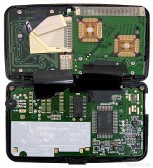 Inside. All of the chips, including display come from Nec. Provision is made for extra ROM and RAM chips.