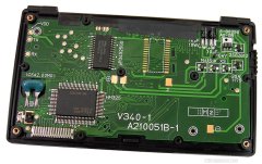 Inside. The all-in-one controller and 32 KB memory chips come from Nec. Note that 2 serial ports (TX & RX) are available and functioning. A hidden function allows to send and receive data. Provision is made for a second 32 KB memory chip.